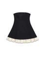 Detailed view of black strapless midi dress with contrasting white ruffled hem detail - S / Black Patchwork Cream