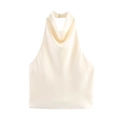 Detail of elegant cream satin halter top featuring a draped cowl neck and button closure - Beige
