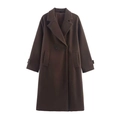 Close-up detail of dark brown wool coat featuring classic notched lapels and double-breasted buttons - Brown