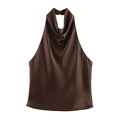 Detail of deep brown satin halter top featuring a cowl neck and silk-like texture - Brown