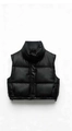 Detail of black puffer vest featuring a stand collar and adjustable drawstring hem - XS / Black