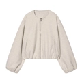 Detail view of the soft oatmeal bomber jacket showing zipper and textured fabric - Apricot