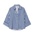 Close-up of blue striped shirt showing brown buttons and size L collar tag detail - Blue and White Stripes