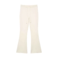 Dettaglio dei pantaloni a zampa color crema a vita alta con coulisse e punte in metallo - S / Bianco latte