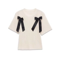 Elegante top in maglia crema a maniche corte con fiocchi neri decorativi e scollo rotondo - S / Bianco latte