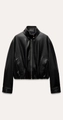 Detail of faux leather jacket featuring stand collar with gold buttons and zip closure - XS / Black