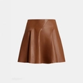 Close-up of diagonal stitching details on a brown leather A-line mini skirt texture - S / Chocolate