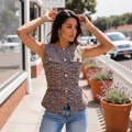 Women's tweed peplum vest in brown and beige featuring embossed gold metal buttons - S / Orange