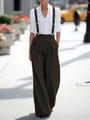 Detail shot of high-waist wide-leg trousers with adjustable brown overall suspender straps - XS / Brown