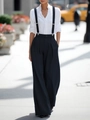 Detail of high-waisted wide-leg trousers with adjustable suspenders and silver buckles - XS / Navy Blue