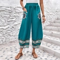 Pantaloni bohémien a gamba larga blu lago con stampa etnica e tasche laterali - M / Teal