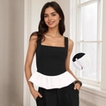 Top negro ajustado con dobladillo peplum blanco y detalle de cremallera oculta - S / Negro/Blanco Patchwork