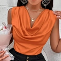Close-up of vibrant orange satin sleeveless top featuring a cowl neck and smooth texture - S / Orange