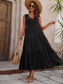 Detail of elegant black sleeveless V-neck tiered maxi dress in a summer vacation setting - S / Black
