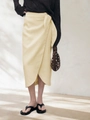 Close-up of linen wrap midi skirt with side tie design and irregular hem - S / Apricot