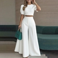 Détail d'un ensemble blanc avec haut boutonné à manches courtes et pantalon à taille haute - S / Haut Et Bas / Blanc