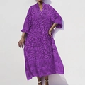 Detail of V-neckline and geometric purple prints on a long kaftan sleeve dress - Purple