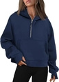 Detail showing navy blue hoodie with thumbholes sleeves and a kangaroo pocket design - Navy Blue
