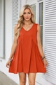 Detail of V-neck orange summer dress with sleeveless pleated waist and functional pockets - Brick Red