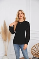 Detail shot of female black long sleeve top featuring intricate floral lace patchwork sleeves - Black