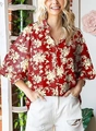 Detail of a floral print long sleeve shirt featuring a lapel collar and buttoned placket - S / Red with Yellow Floral (Image 8)