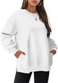 Detail of white oversized sweatshirt showing side pockets and ribbed crew neck design - White