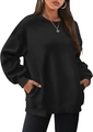 Detail view of oversized black sweatshirt featuring side slit pockets and a relaxed crewneck fit - Black