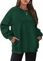 Detail of forest green oversize sweatshirt showing side hidden pockets and fleece texture - Dark Green