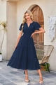 Detail of the navy blue V-neck dress featuring a tiered skirt and textured striped fabric - Navy Blue