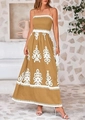 Detail van de boheemse maxi-jurk in mosterdgeel met bloemenprint en geplooid borstgedeelte - S / Gembergeel