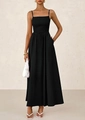 Close-up of a black pleated smocked maxi dress with thin straps and side pockets - S / Black