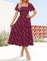 Detail of bohemian tiered floral dress featuring a square neck and smocked bodice detail - Burgundy