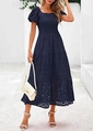 Detailed close-up of dark blue dress featuring embroidery and a layered tiered skirt - Navy Blue