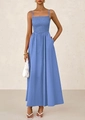 Detailed view of the smocked bodice and thin straps on this light blue summer dress - Blue