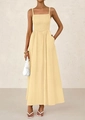 Close-up of smocked bodice and thin straps on a cream yellow maxi sun dress - Yellow