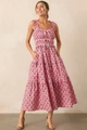 Detailed close-up of pink floral dress featuring ruffled straps and tiered skirt design - S / Pink