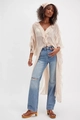 Macro detail of sheer peach ruffles on a lightweight French style vacation cover-up - S / Tops / White