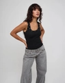 Close-up of black ribbed tank top featuring punk style metal grommets along the U-neckline - S / Tops / Black
