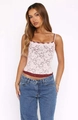 Detail of pink floral lace camisole top featuring contrasting deep red scalloped edges - S / Tops / Pink