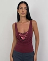 Detailed view of the sparkling burgundy sequin top with a stylish V-neck drape design - S / Burgundy