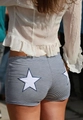 Detail of blue and white striped shorts with a large white star patch on the back - S / Blue
