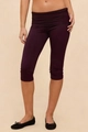 Detail of high-waisted dark purple capri yoga leggings with fold-over waistband design - S / Bottoms / Purple