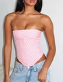 Detail of pink polka dot corset top with tie-waist and asymmetrical hem design - Rose Red