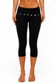 Close-up of black high-waisted capri yoga pants featuring decorative waist buttons - S / Black