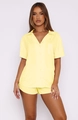 Detail of soft yellow short sleeve pajama set with button-down collar and chest pocket - S / Yellow