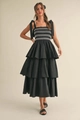 Detalle del vestido midi negro de varias capas con lazos en los hombros y bordado - S / Negro