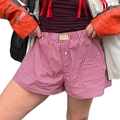 Close-up of red and white gingham casual shorts with elastic waistband and single button - S / Red