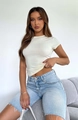 Slim fit cream t-shirt paired with light blue distressed denim shorts for summer fashion - Apricot