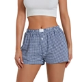 Detalle de los pantalones cortos vichy azules de talle alto con cintura elástica - Azul