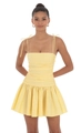 Close-up of ruched bodice and thin spaghetti straps on a light yellow mini dress - S / Yellow
